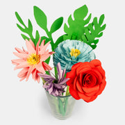 Cup of flowers and leaves made out of cute paper and assembled to make various flower kinds.