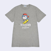 Gray t-shirt with an illustrated graphic of Doraemon, a blue earless cat character, wearing a backwards red hat and riding a yellow skateboard. Text reads "I'm Doraemon plays skateboard"