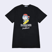 Black t-shirt with an illustrated graphic of Doraemon, a blue earless cat character, wearing a backwards red hat and riding a yellow skateboard. Text reads "I'm Doraemon plays skateboard"
