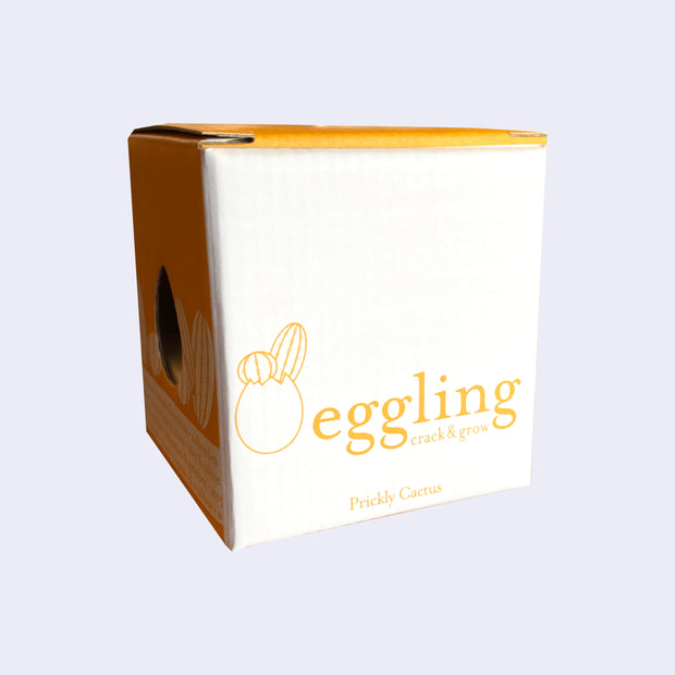 White cardboard box for "Eggling Crack & Grow"