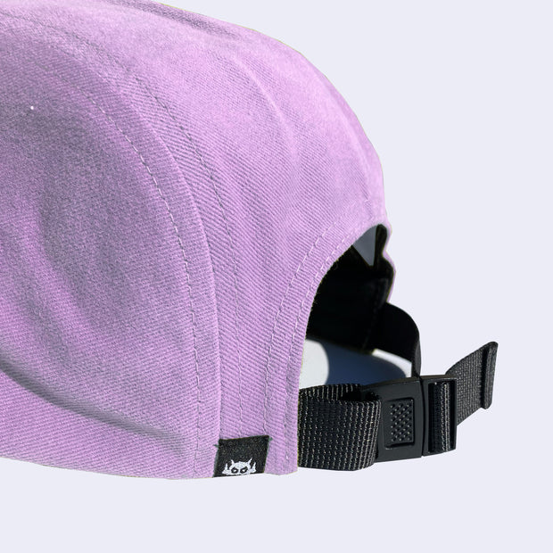 Back view of lavender cap, with adjustable strap to change fit.