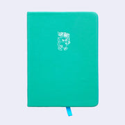 Turquoise pleather covered sketchbook with a small embossment of a robot carrying a flag that reads "Giant Robot" in the upper center.