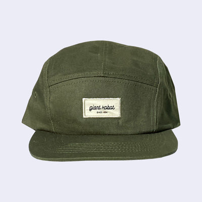 Dark green 5 panel cap, with a cream colored rectangle embroidering in the center that reads "giant robot' in lowercase cursive and "since 1994" in smaller, caps font below. 