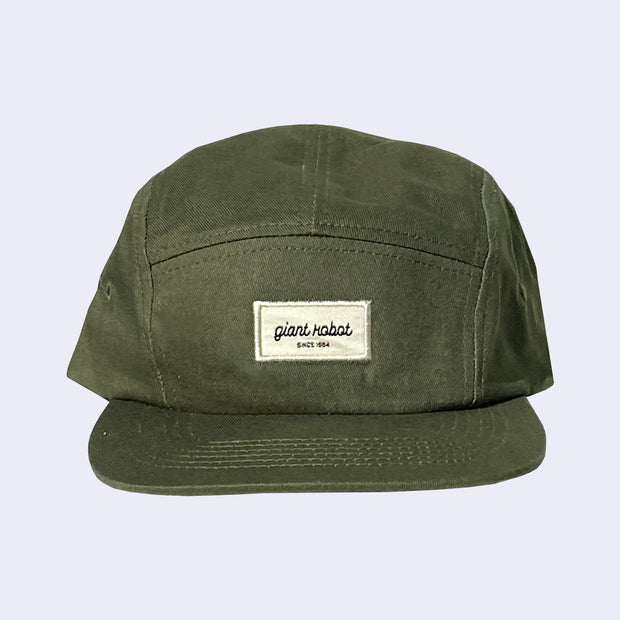 Dark green 5 panel cap, with a cream colored rectangle embroidering in the center that reads "giant robot' in lowercase cursive and "since 1994" in smaller, caps font below. 