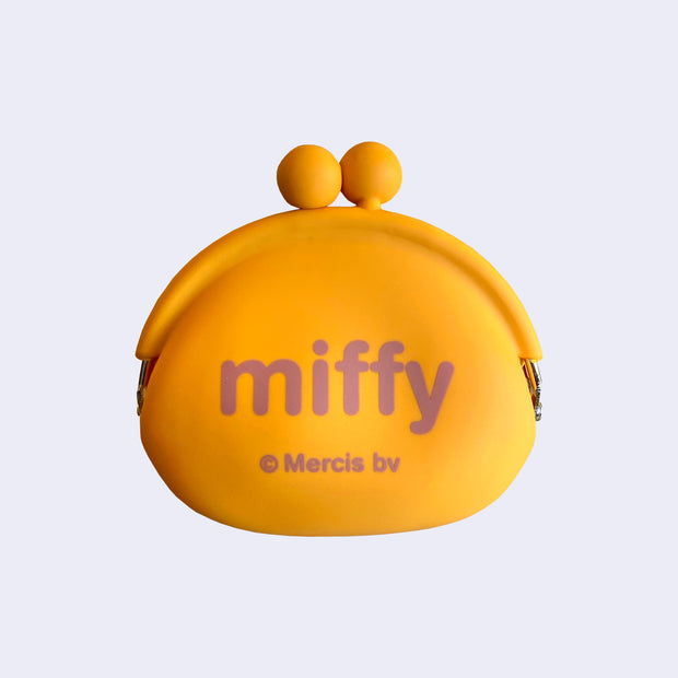 Backside of orange silicone coin pouch with Miffy written in all lowercase brown font.